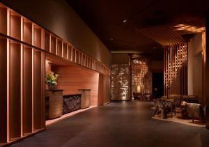 a hallway with a fireplace in a hotel lobby at Nobu Hotel Atlanta in Atlanta
