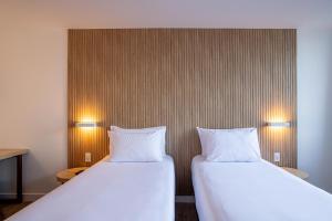 Postel nebo postele na pokoji v ubytování Sooz Hotel Collection