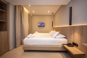 Postel nebo postele na pokoji v ubytování Hotel Portanova