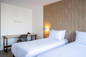 Postel nebo postele na pokoji v ubytování Sooz Hotel Collection
