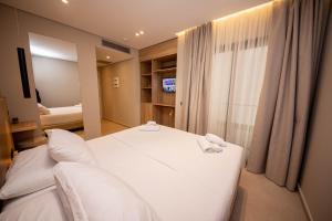 Postel nebo postele na pokoji v ubytování Hotel Portanova