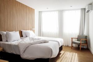 Postel nebo postele na pokoji v ubytování Sooz Hotel Collection