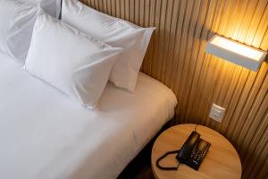 Postel nebo postele na pokoji v ubytování Sooz Hotel Collection