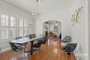 a dining room with a table and chairs at Vibrant, Quirky Home with Hot Tub Near S Congress in Austin