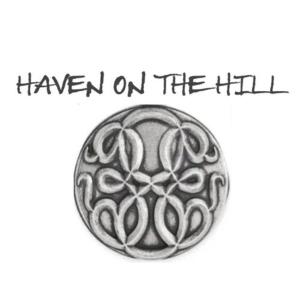 a silver button with the wordshaven on the hill at Haven on the Hill in Ashville
