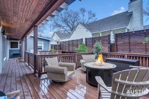 a patio with chairs and a fire pit on a deck at Fun For the Whole Family - Easy Access to Downtown in Austin