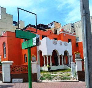 a street sign in front of a building at Great Partners hostel in Lima