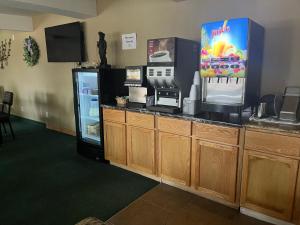 a kitchen with a counter with a refrigerator at Docker's Inn in Branson