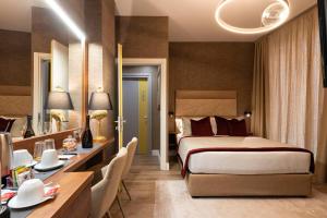 Postel nebo postele na pokoji v ubytování Royal Rooms Corso