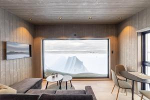 a living room with a large glass window at Varanger View in Vardø