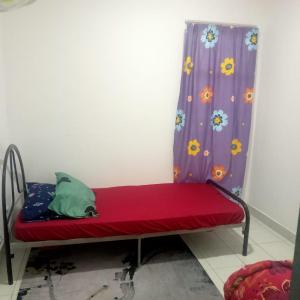 Ein Bett oder Betten in einem Zimmer der Unterkunft Homestay Danau Ria @ Gamuda Gardens