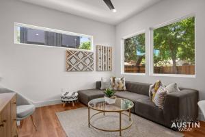 a living room with a couch and a table at Brand New Luxurious Property and Huge Outdoor Space in Austin