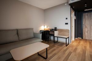 a living room with a couch and a table at Hotel Primavera Park in Benidorm