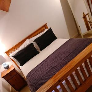 A bed or beds in a room at Newditch Farm Accommodation
