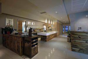 a large kitchen with a sink and a counter at Hotel Grace in Međugorje