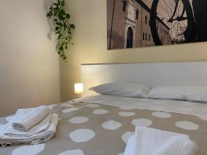 Postel nebo postele na pokoji v ubytování Downtown - Camere in Centro