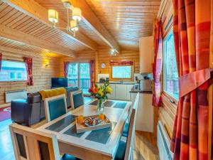 a living room and kitchen in a tiny house at Forest Lodge in Legbourne