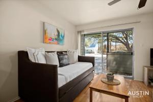 a living room with a couch and a window at Relax in Hyde Park Parking Great Location and Tub in Austin