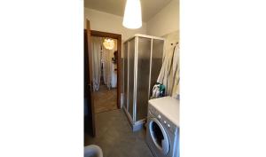 a bathroom with a washer and dryer in a room at Lakeside apartment Tremezzo - Larihome B01 in Tremezzo
