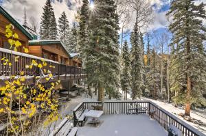 a winter view of a cabin with snow on the porch at The Cottages Chic Ski-InandSki-Out Mountain Condo! in Beaver