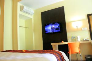 Ένα ή περισσότερα κρεβάτια σε δωμάτιο στο M Hotel