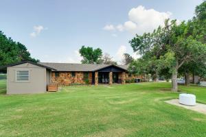 a house with a large yard in front of it at Spacious Country Home Near Ft Sill and Medicine Park in Lawton