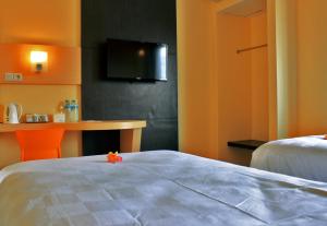Ένα ή περισσότερα κρεβάτια σε δωμάτιο στο M Hotel