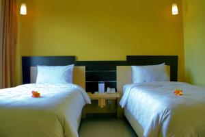Ένα ή περισσότερα κρεβάτια σε δωμάτιο στο M Hotel