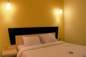 Ένα ή περισσότερα κρεβάτια σε δωμάτιο στο M Hotel