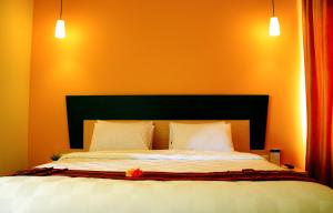 Ένα ή περισσότερα κρεβάτια σε δωμάτιο στο M Hotel