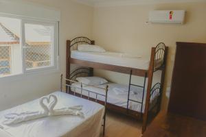 Postel nebo postele na pokoji v ubytování Apartamento Vivendas de Canela, uma quadra da Catedral