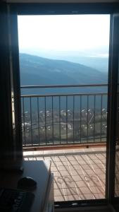 a view of a balcony from a room with a window at B&B Il Belvedere Viggiano in Viggiano
