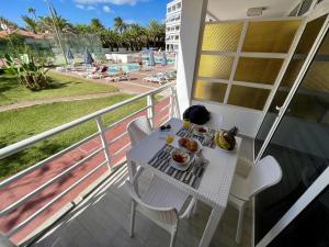 A balcony or terrace at Pretty pool view holiday home