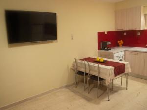 A kitchen or kitchenette at Charming apartment in Halepa!