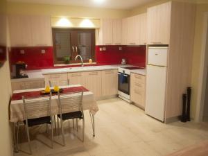 A kitchen or kitchenette at Charming apartment in Halepa!