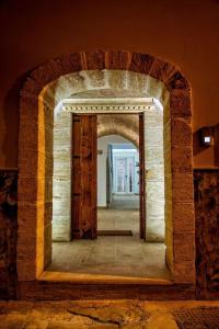 a brick hallway with an archway in a room at La Corte GIO' in Taurisano