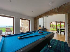 a billiard room with a pool table in a house at Balloan Steading West in Dornoch