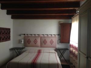 a bedroom with a bed in a room with a window at Guest House Il Giardino Segreto in Cagliari