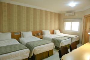 Postel nebo postele na pokoji v ubytování GoldMen Select Cianorte