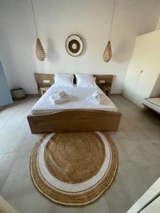 A bed or beds in a room at Sohoros Luxury Suites
