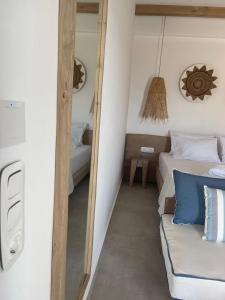 A bed or beds in a room at Sohoros Luxury Suites