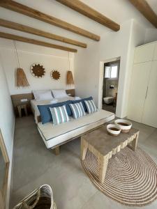 A bed or beds in a room at Sohoros Luxury Suites