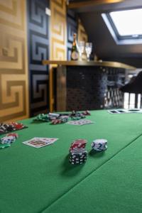 a group of poker chips on a green poker table at Mischief Liverpool in Liverpool