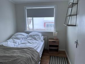 Кровать или кровати в номере Akureyri apartments