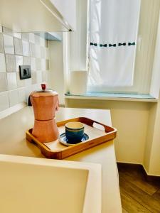 a mortar and pestle on a cutting board on a kitchen counter at Wasi edy in Turin