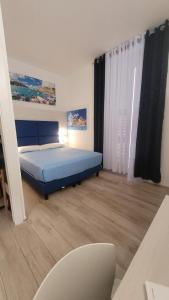 Postel nebo postele na pokoji v ubytování Affittacamere 5 Terre Dolci Sogni