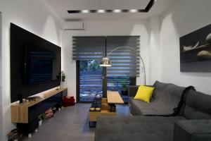 Ruang duduk di Nisi Luxury Suites with private pool in Gouves