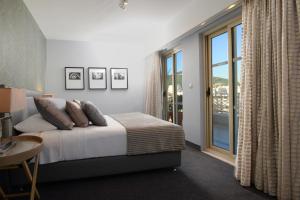 A bed or beds in a room at Airotel Stratos Vassilikos Hotel