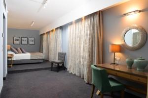 A bed or beds in a room at Airotel Stratos Vassilikos Hotel