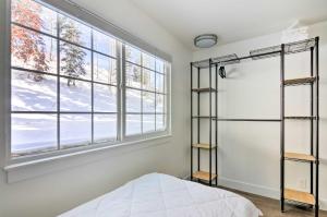 a bedroom with a bed and a window at The Cottages Ski-InandSki-Out Condo at Eagle Point! in Beaver